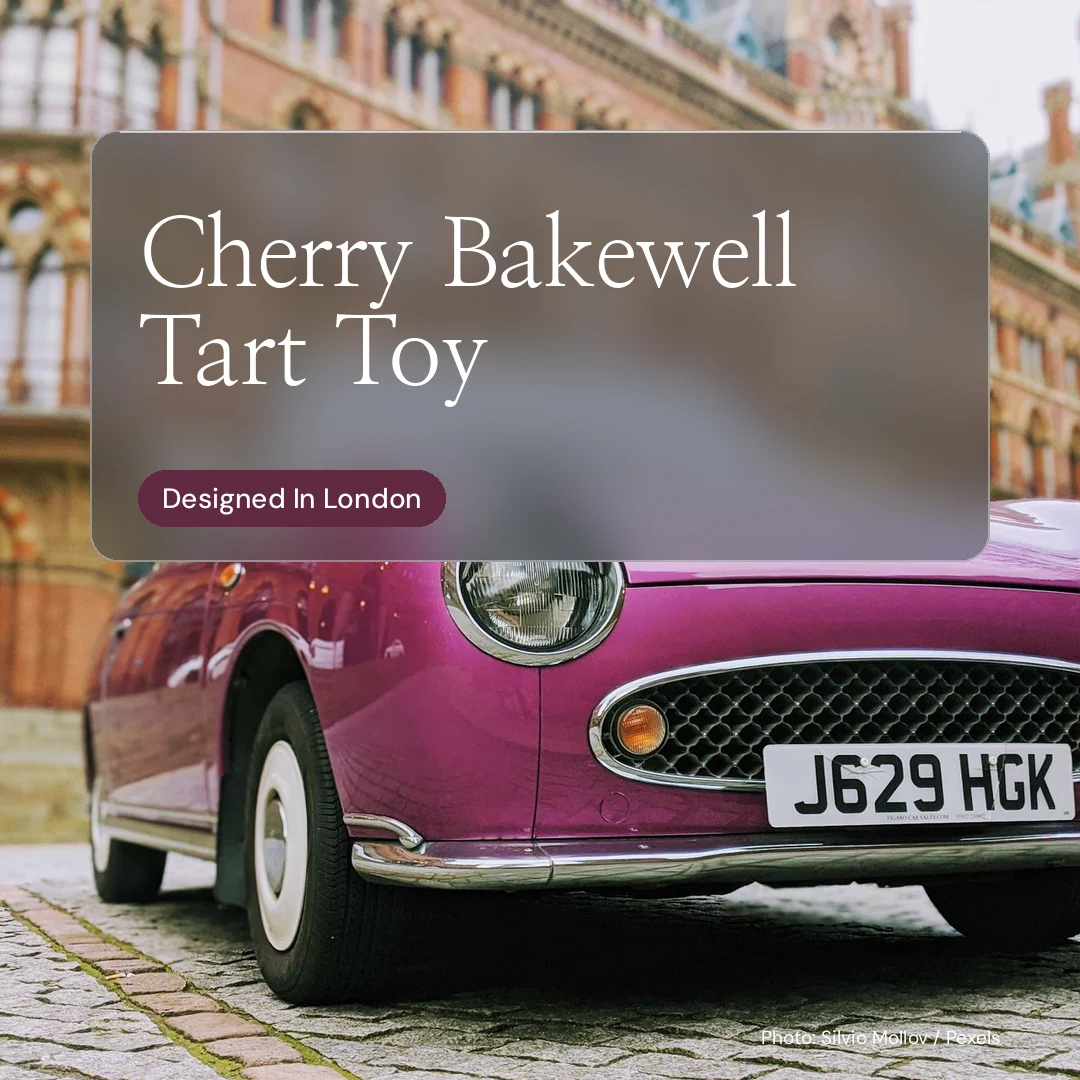 Instagram post for By Teddy: "Cherry Bakewell Tart Toy". Glass style, technique:pexels ingredient layout, light palette in grey, red.