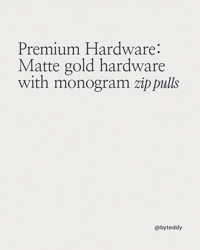 Instagram portrait post for By Teddy: "Premium Hardware: Matte gold hardware with monogram zip pulls". Editorial style, technique:mixed type lockup layout, light palette in white.
